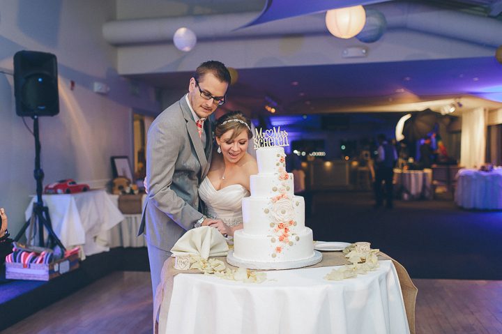 Cake cutting during a McLoones Pierhouse Wedding in Long Branch, NJ. Captured by NYC wedding photographer Ben Lau.