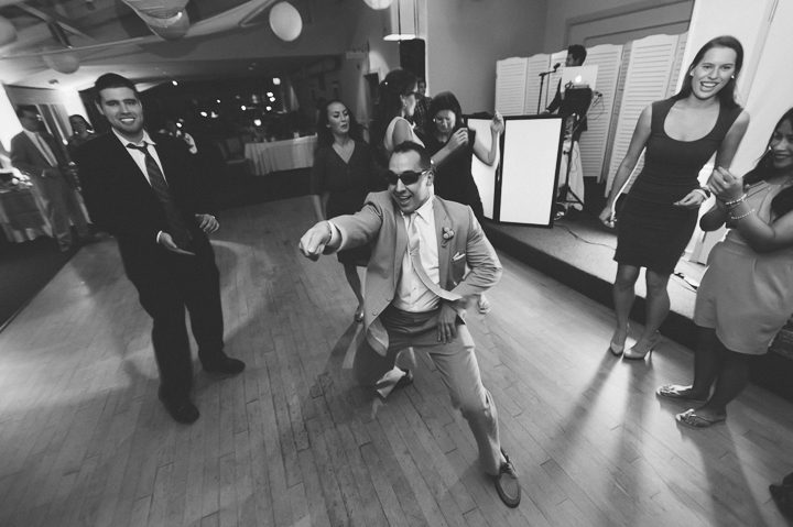 Guests dance during a McLoones Pierhouse Wedding in Long Branch, NJ. Captured by NYC wedding photographer Ben Lau.