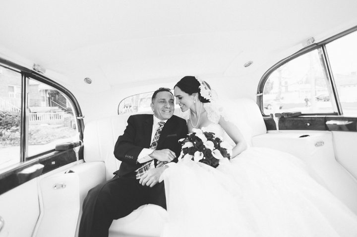 Bride sits in the limo with her father, before her wedding at the Crest Hollow Country Club. Captured by NYC wedding photographer Ben Lau.