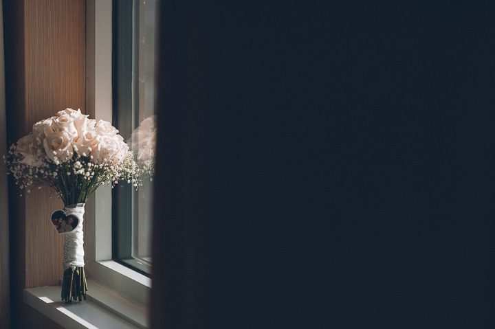 Wedding flowers inside the bridal suite of the Sheraton Laguardia East in Flushing, NY. Captured by NYC wedding photographer Ben Lau.