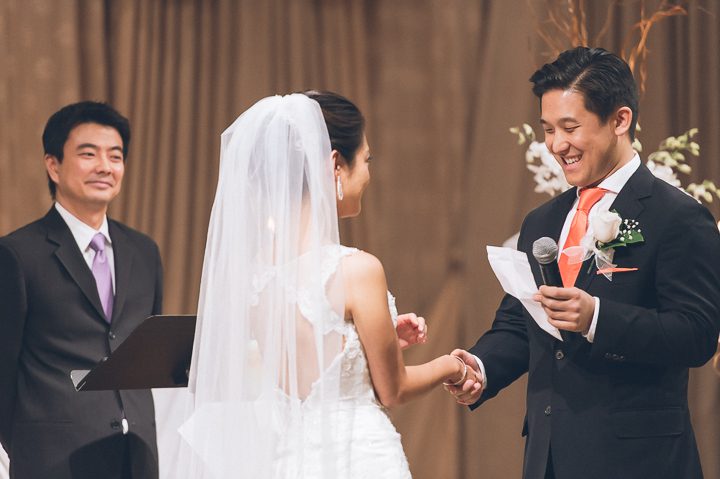 Groom reads his vows during a wedding ceremony at Dae Dong Manor in Flushing, NY. Captured by NYC wedding photographer Ben Lau.