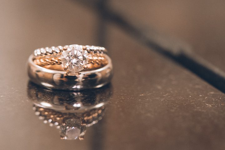 Wedding rings at Dae Dong Manor in Flushing, NY. Captured by NYC wedding photographer Ben Lau.