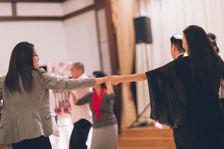 Guests dance during a wedding reception at Dae Dong Manor in Flushing, NY. Captured by NYC wedding photographer Ben Lau.