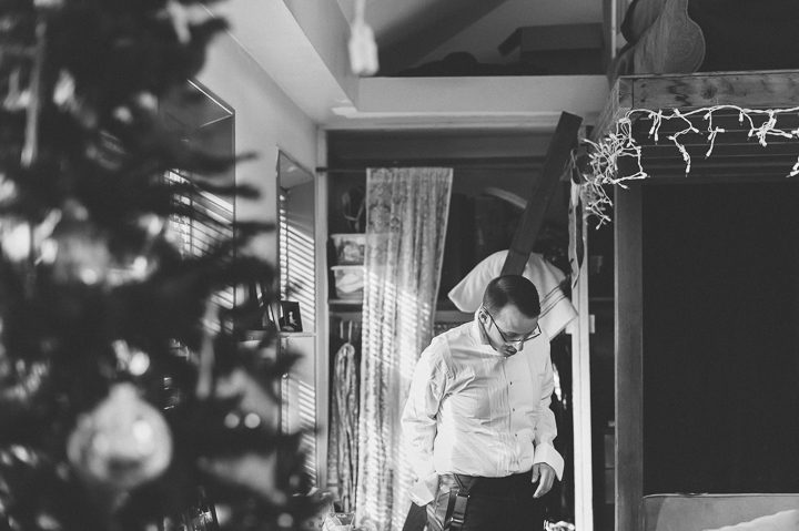 Groom gets ready at home on the morning of his wedding day at Kirkpatrick Chapel in New Brunswick, NJ. Captured by Central Jersey Wedding Photographer Ben Lau.