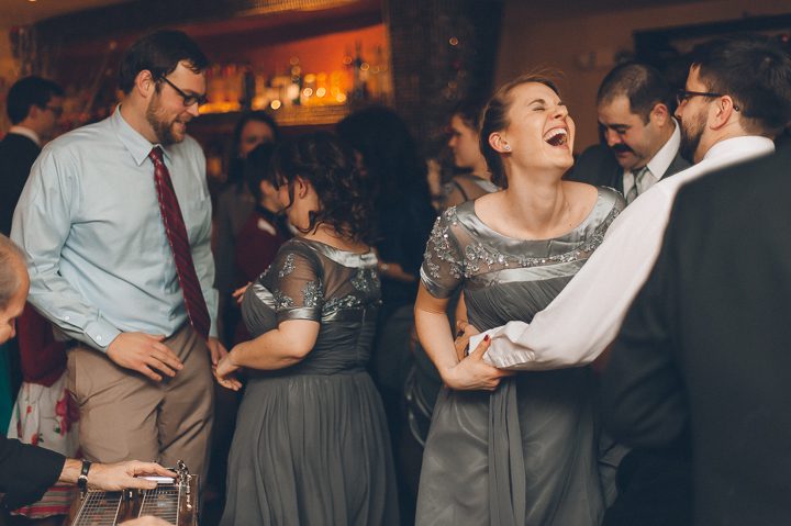 Guests dance during wedding at Tula's Lounge in New Brunswick, NJ. Captured by Central Jersey Wedding Photographer Ben Lau.