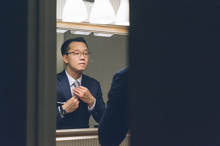 Groom get ready for his wedding day at Mudan's. Captured by NYC wedding photographer Ben Lau.