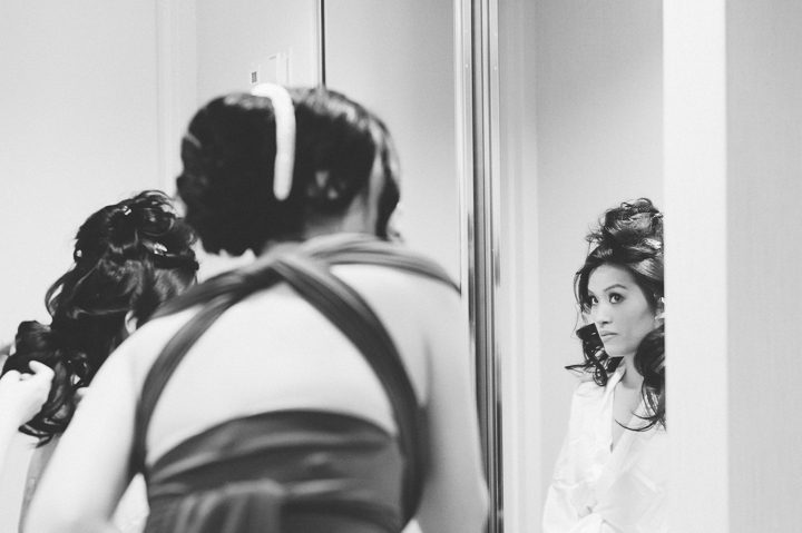 Bride gets ready for her wedding day at Mudan's. Captured by NYC wedding photographer Ben Lau.