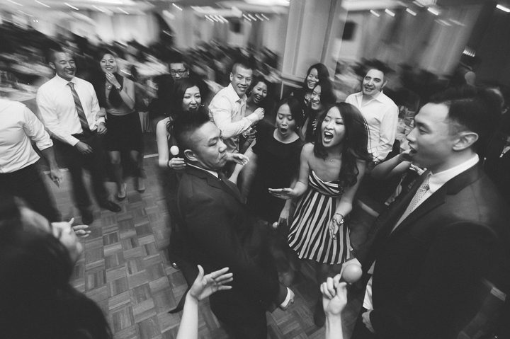 Guests dance during a wedding reception at Mudan's in Flushing Queens. Captured by NYC wedding photographer Ben Lau.