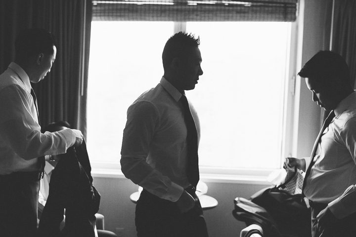Groomsmen get ready for a wedding day at Mudan's. Captured by NYC wedding photographer Ben Lau.