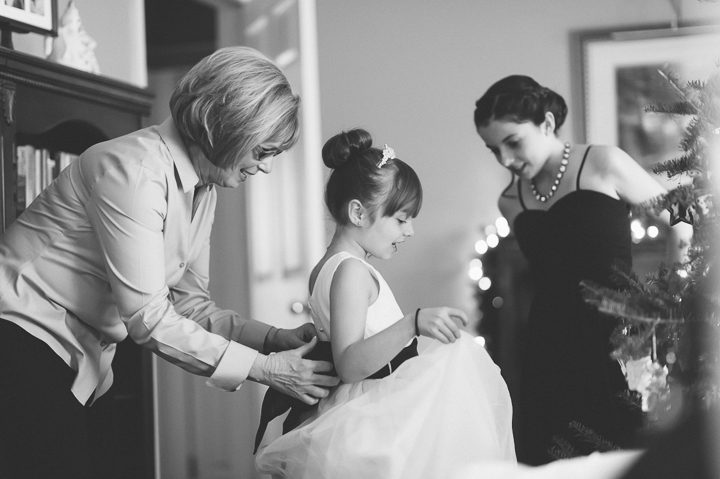Flower girl gets ready for a wedding at the Westmount Country Club. Captured by Northern NJ wedding photographer Ben Lau.