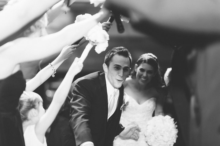 Bride and groom's grand entrance during a wedding reception at the Westmount Country Club. Captured by Northern NJ wedding photographer Ben Lau.