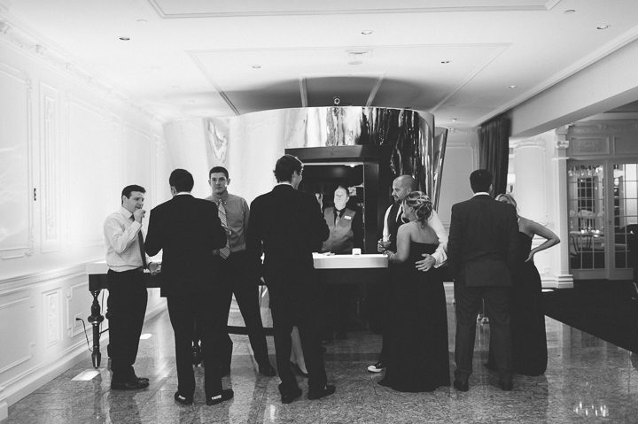 Guests queue at the bar during a wedding reception at the Westmount Country Club. Captured by Northern NJ wedding photographer Ben Lau.
