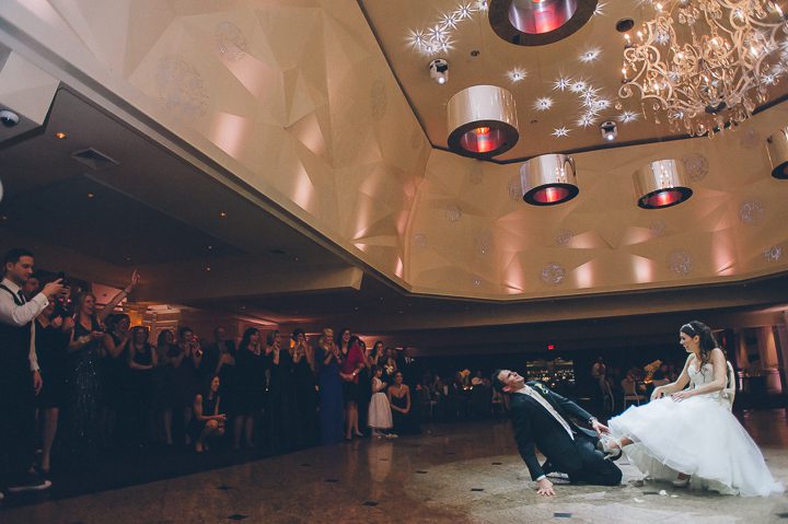 Garter toss during a wedding reception at the Westmount Country Club. Captured by Northern NJ wedding photographer Ben Lau.