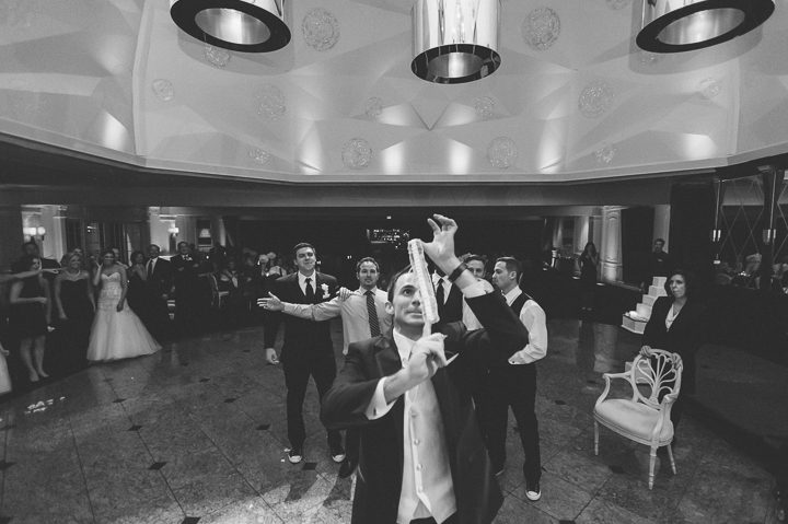Bouquet toss during a wedding reception at the Westmount Country Club. Captured by Northern NJ wedding photographer Ben Lau.