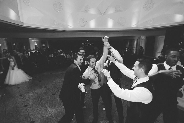 Garter toss during a wedding reception at the Westmount Country Club. Captured by Northern NJ wedding photographer Ben Lau.