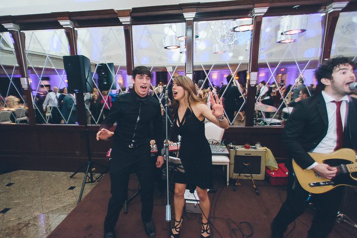 Guest sings with the band during a wedding reception at the Westmount Country Club. Captured by Northern NJ wedding photographer Ben Lau.