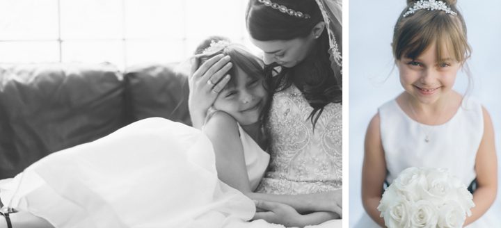 Bride hugs flower girl on the morning of her wedding at the Westmount Country Club. Captured by Northern NJ wedding photographer Ben Lau.