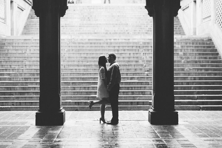 Kiss under the Bethesda Arcade in Central Park. Captured by NYC wedding photographer Ben Lau.