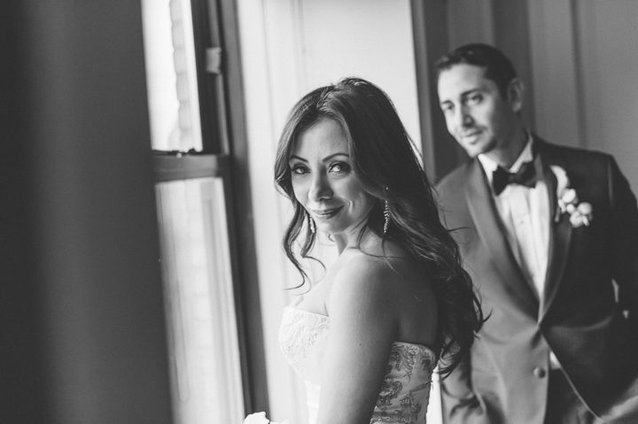 Bride and groom portrait inside the Essex House. Captured by NYC wedding photographer Ben Lau.