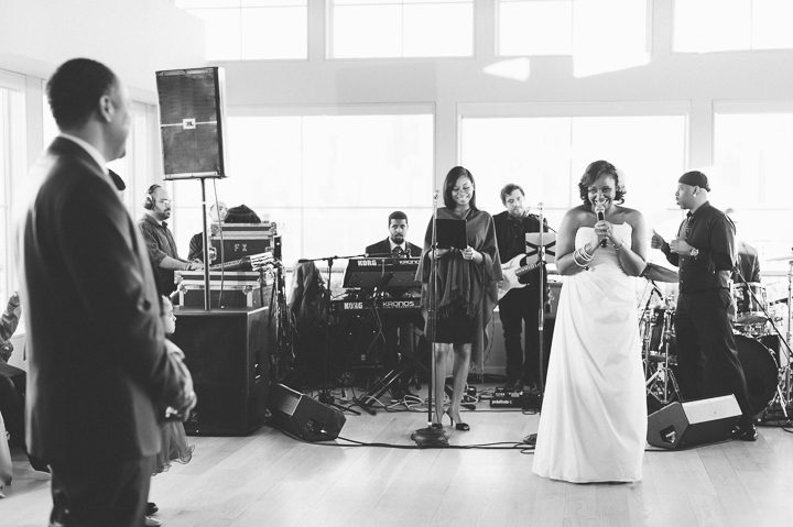 Bride sings for the groom during a wedding at the Maritime Parc in Jersey City, NJ. Captured by NYC wedding photographer Ben Lau.
