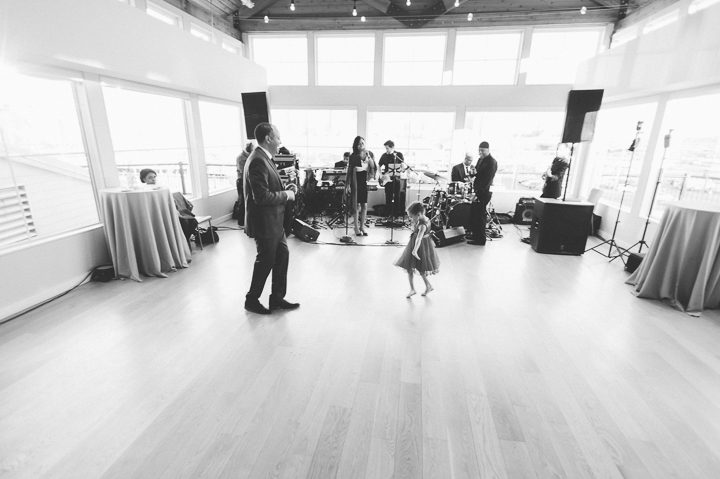 Groom dances with his daughter at the Maritime Parc in Jersey City, NJ. Captured by NYC wedding photographer Ben Lau.