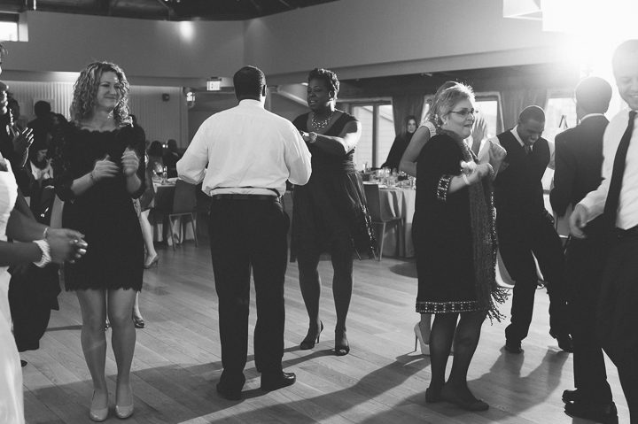 Wedding guests dance at the Maritime Parc in Jersey City, NJ. Captured by NYC wedding photographer Ben Lau.