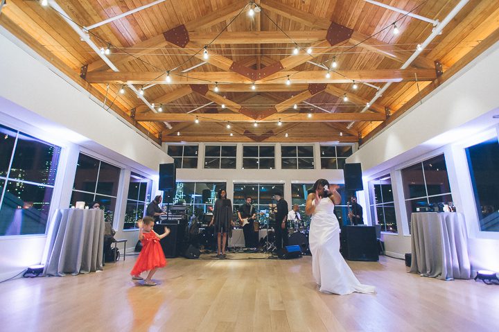 Bride dances with her new daughter at a wedding reception at the Maritime Parc in Jersey City, NJ. Captured by NYC wedding photographer Ben Lau.