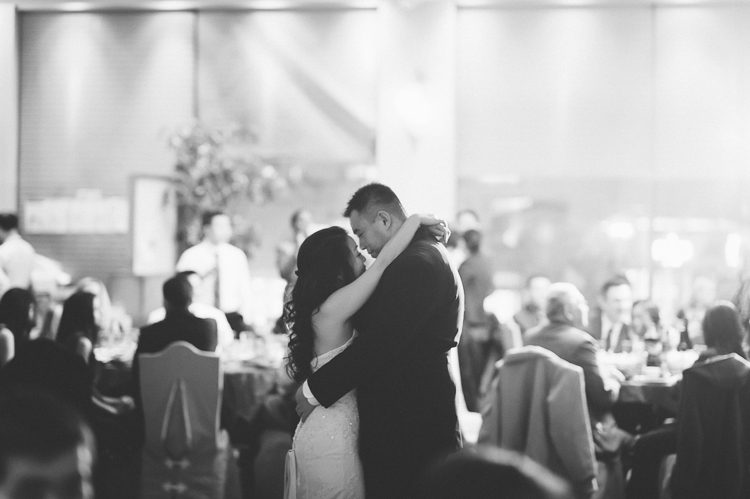 Bride and groom's first dance during their wedding at the Jade Asian Restaurant in Flushing, Queens. Captured by NYC wedding photographer Ben Lau.
