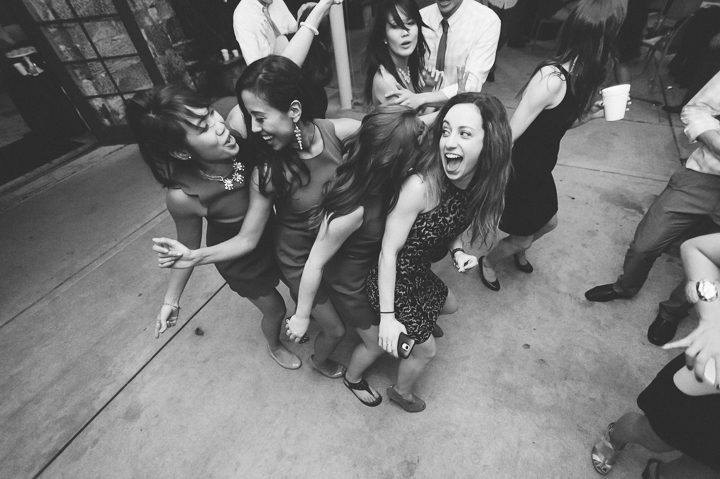 Guests dance during a wedding reception at the Red Fish Grill in Miami, FL. Captured by Miami wedding photographer Ben Lau.