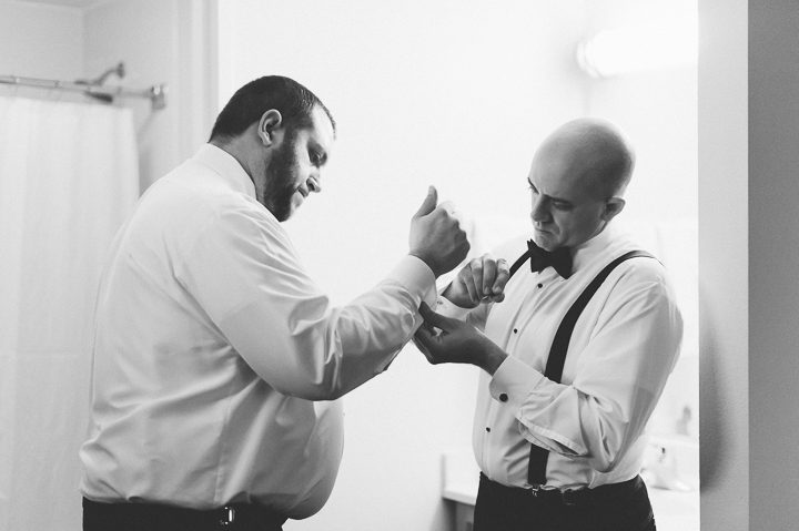 Groomsmen preps for a wedding at the Franklin Institute in Philadelphia. Captured by NYC wedding photographer Ben Lau.