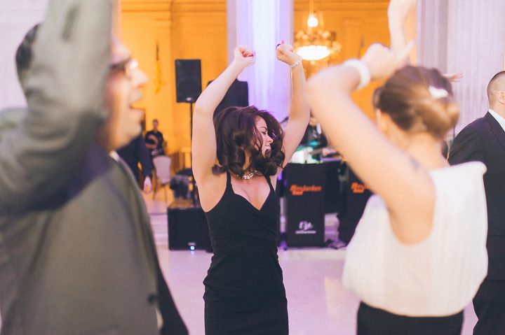 Wedding guests dancing at the Franklin Institute in Philadelphia. Captured by NYC wedding photographer Ben Lau.