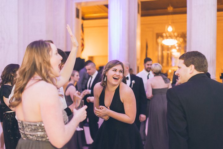 Wedding guests dancing at the Franklin Institute in Philadelphia. Captured by NYC wedding photographer Ben Lau.