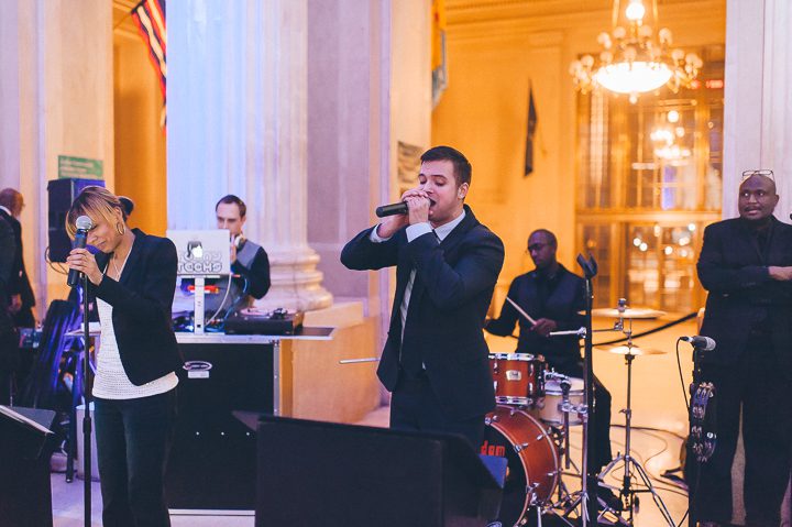 Live band performs during a wedding at The Franklin Institute in Philadelphia. Captured by NYC wedding photographer Ben Lau.