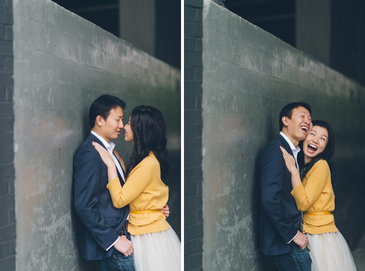 Couple laughs together during their engagement session at the High Line in NYC. Captured by NYC wedding photographer Ben Lau.