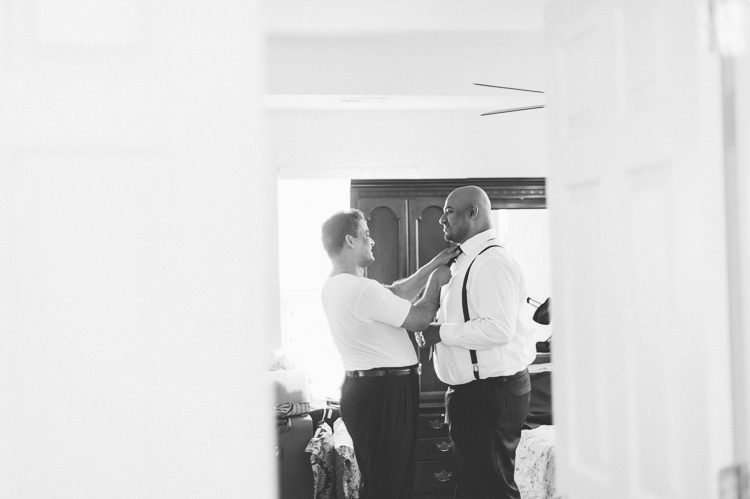 Groom preps on the morning of his wedding at Normandy Farms in Blue Bell, PA. Captured by Philadelphia wedding photographer Ben Lau.