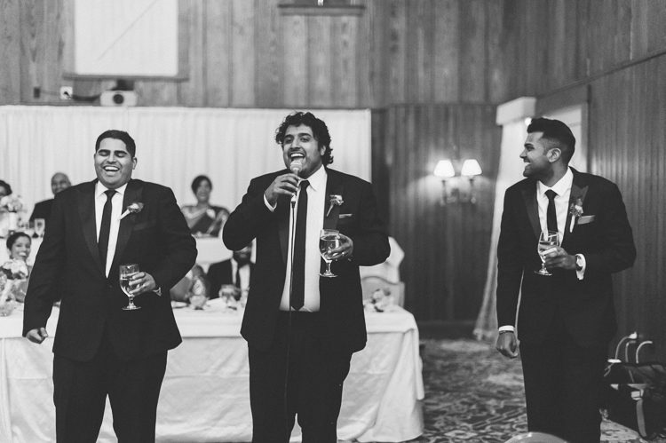 Toasts during a wedding reception at Normandy Farms in Blue Bell, PA. Captured by Philadelphia wedding photographer Ben Lau.