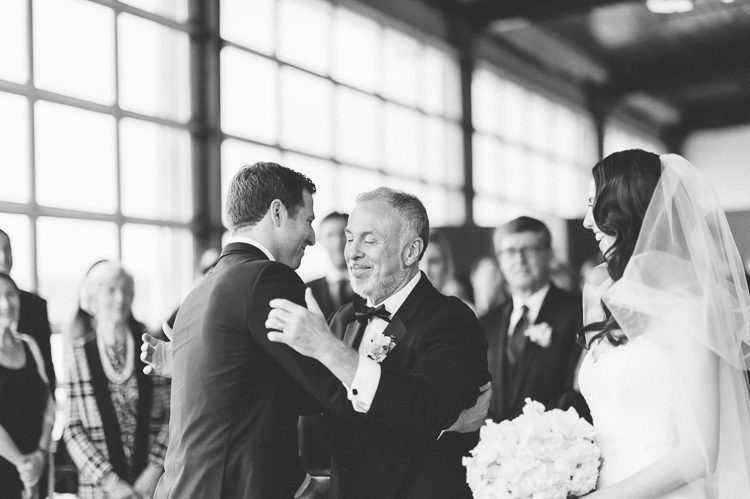 Father of the groom gives his daughter away during a wedding ceremony at Pier 60 and the Light House. Captured by NYC wedding photographer Ben Lau.