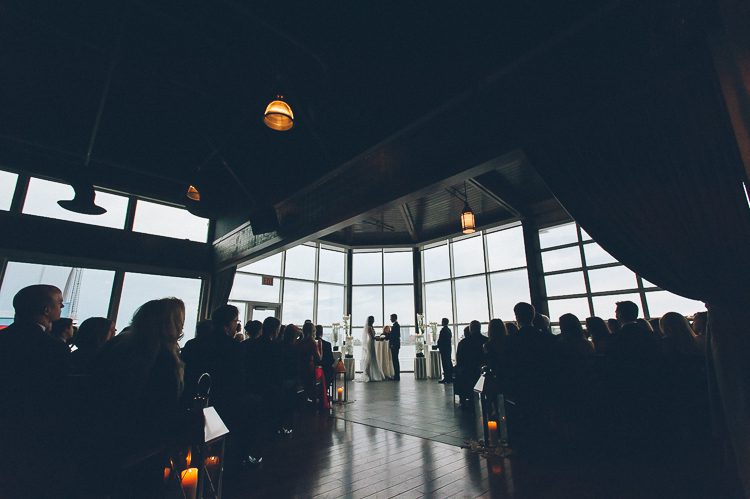 Wedding ceremony at Pier 60 & The Lighthouse. Captured by NYC wedding photographer Ben Lau.