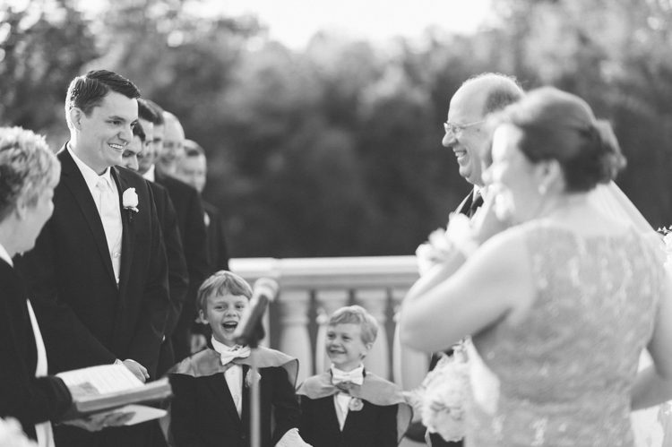 Groom reacts after seeing his bride for the first time, during their wedding ceremony at The Palace at Somerset Park. Captured by Northern NJ wedding photographer.