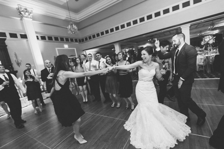 Bride dances with her guests during her wedding at The Palace at Somerset Park. Captured by Northern NJ wedding photographer Ben Lau.
