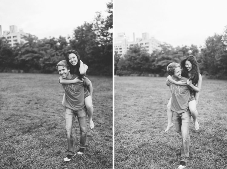 Laura & Jason play on the grass during their engagement session in DUMBO Brooklyn. Captured by NYC wedding photographer Ben Lau.