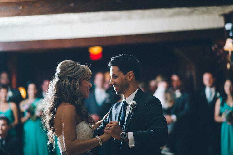 Bride and groom's first dance during a wedding reception at the Lake Valhalla Club in Montville, NJ. Captured by NJ wedding photographer Ben Lau.
