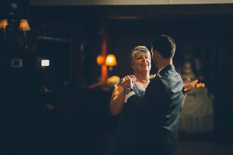 A groom dances with his mother during a wedding reception at the Lake Valhalla Club in Montville, NJ. Captured by NJ wedding photographer Ben Lau.