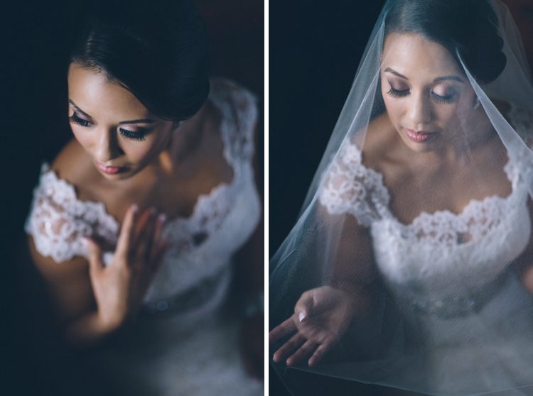 Bride plays with her veil on the morning of her wedding at Maritime Parc in Jersey City, NJ. Captured by NYC wedding photographer Ben Lau.