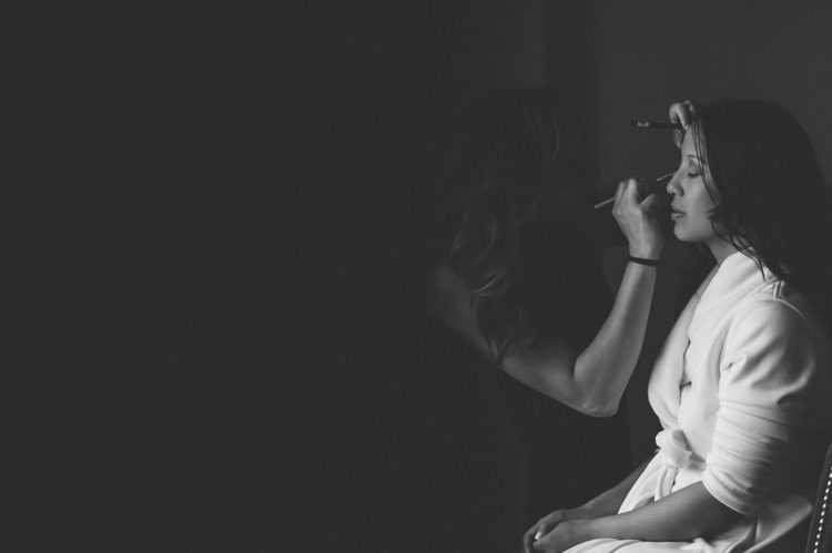Bride preps in hotel room in Jersey City. Captured by NYC wedding photographer Ben Lau.
