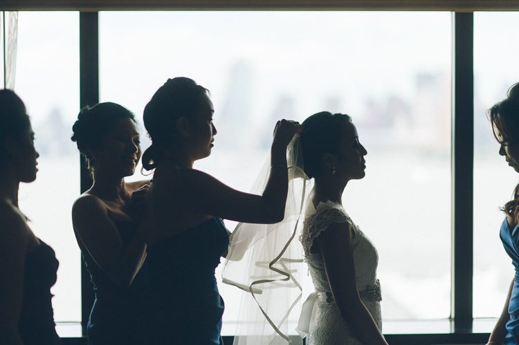 Bride preps for her wedding day in Jersey City. Captured by NYC wedding photographer Ben Lau.