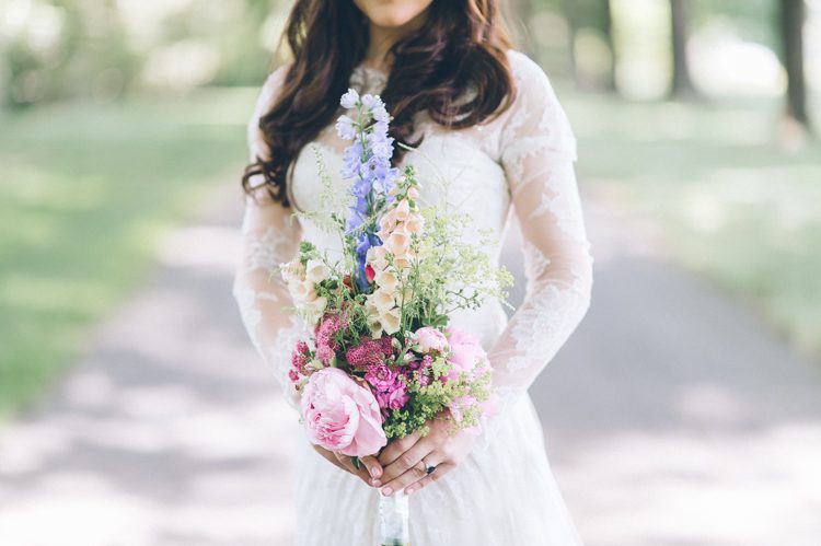 Bride's portrait with her wedding bouquet on the morning of her Florence Griswold Museum Wedding in Old Lyme, CT. Captured by NYC wedding photographer Ben Lau Photography.