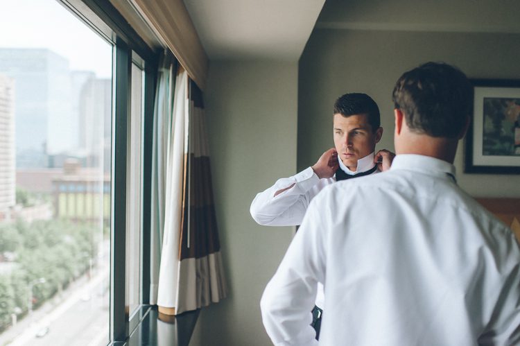 Groom prepares on the morning of his wedding day at the Liberty House in Jersey City, NJ. Captured by awesome NJ wedding photographer Ben Lau.