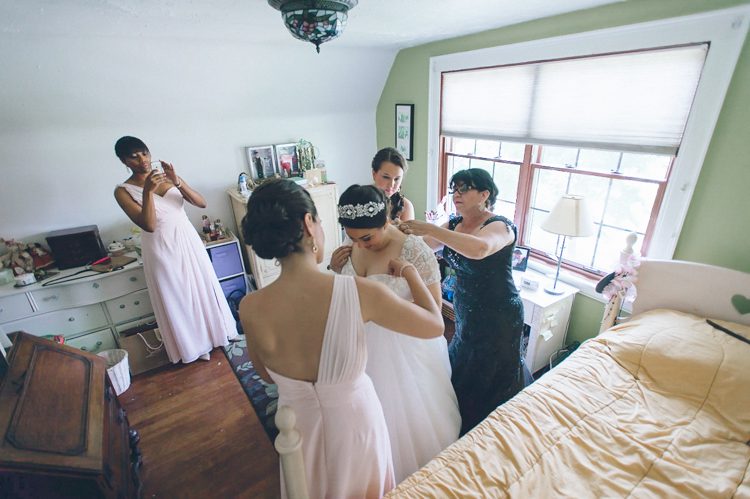 Bride gets ready on the morning of her wedding day at the Inn at New Hyde Park. Captured by NYC wedding photographer Ben Lau.