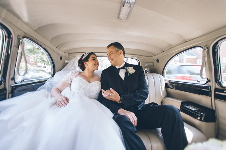 Bride en route to St. Andrew Avellino Church on her wedding day. Captured by NYC wedding photographer Ben Lau.